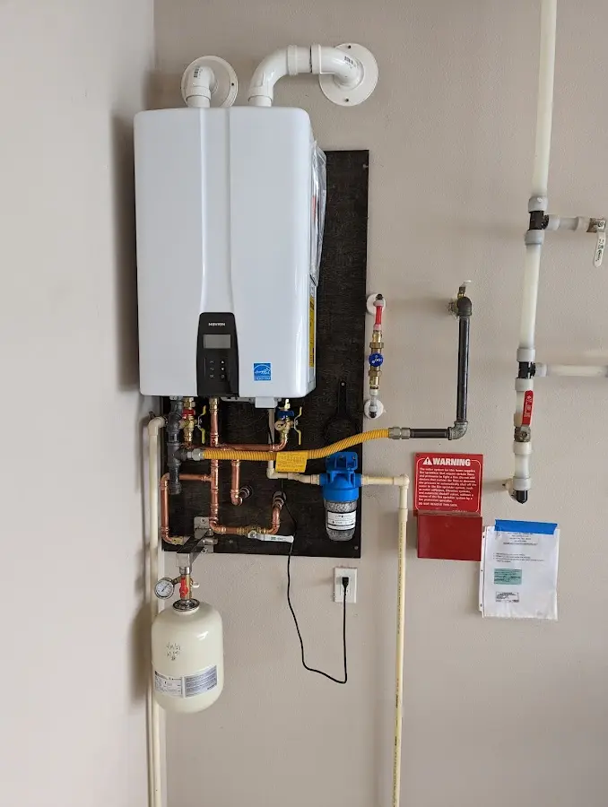 Professional plumber installing copper piping in a Clarks Summit home